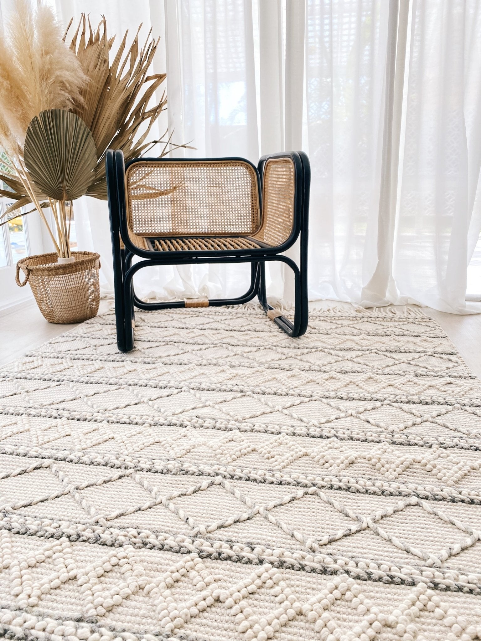 https://lustereliving.co/cdn/shop/products/mila-ivory-neutral-soft-texture-braided-tribal-wool-area-rug-811392.jpg?v=1641525762